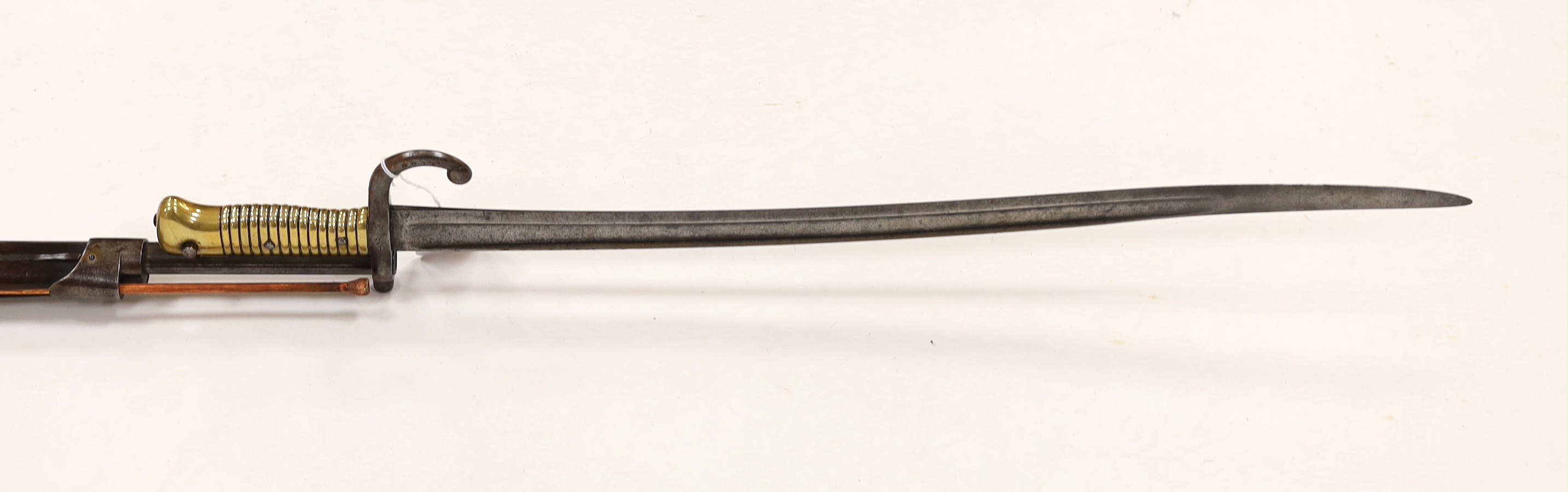 A French Chassepot bolt action rifle 1865-1874 with regulation, iron mounts, and 1868 brass handle bayonet dated 1868, barrel 79cm